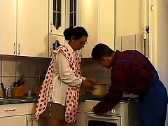 Good-looking mature babe in glasses gets wild fucking in kitchen